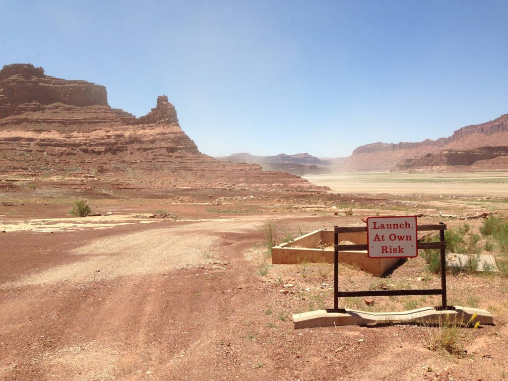 A boat launch ramp at Hite Marina, located at the Northern end of Lake Powell. Water levels at Lakes Mead and Powell have been declining for years, causing the lake to contract. Lake Powell is currently 45 percent full. Image credit: Charles Carlin, 2013.