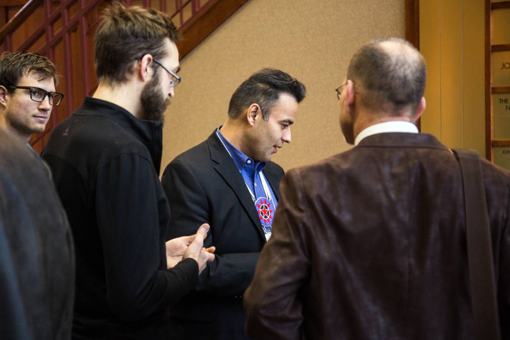 Wooten presenting the eighth bundle to Ho-Chunk Nation president Jon Greendeer. Photo by Jim Escalante.