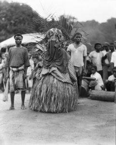 Bassa Devil and attendants on Division 2 of the Firestone Plantations Company, once the traditional lands of the Bassa people. Loring Whitman, August 11, 1926. Indiana University Liberian Collections.
