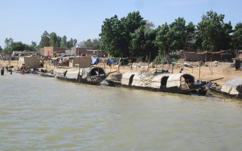 Small transport boats along the banks of a Niger Delta village. Photograph by Matt Turner on November 4, 2014.