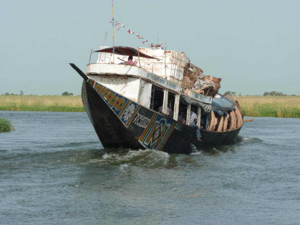 A transport boat on the Niger Delta. Photograph by Pierre Hiernaux on October 26, 2014. Image used with kind permission.