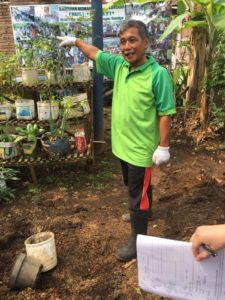 Bapak Gito explains how trash becomes a garden at Bank Sampah Makmur, Salatiga. Photo by Elyssa Burns.