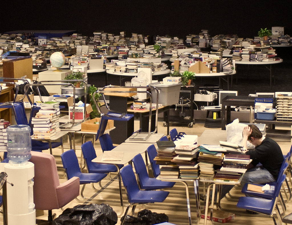 Books from the library of the Oak Grove Luthern School are rescued from a flood of the Red River in April 2009. Photo by Patsy Lynch/FEMA.