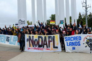 Demonstrators, led by activists from the Indigenous Environmental Network, gather in Bismarck, North Dakota to speak out against the proposed Dakota Access pipeline. Image by author, September 2016.