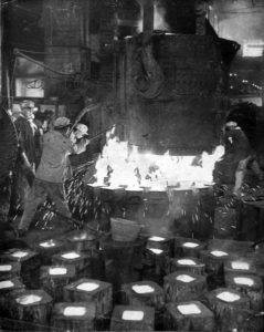Steel production in China during the late 1950s. Photo by Li Jiuling, 1957, via Wikimedia Commons.