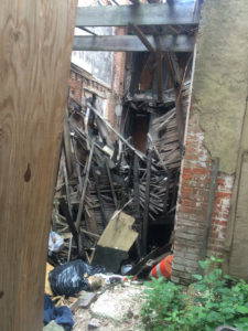 A crumbling building creates pockets where standing water can collect and become a breeding ground for mosquitos. Photo by Dawn Biehler, 2016.