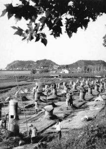 Backyard furnaces in China during the Great Leap Forward. Author unknown, 1958, via Wikimedia Commons.