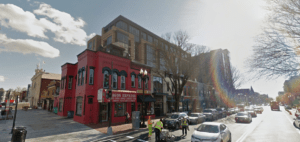 The corner of 7th St. and T St. The Howard Theater (far left) stands next to luxury apartments squeezed behind old storefronts. Image from Google Street View.