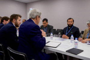 U.S. Secretary of State, John Kerry and his team meet with India's Environment Minister Prakash Javadekar at COP21 in Paris. U.S. Department of State, 2015.