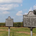 A roadside sign, far from view of Davis Island, tells an abridged version of its history. Far more words are used on the neighboring sign to recount a minor chapter of Civil War history. Corn fields fill the background, as they do an annually increasingly proportion of Louisiana’s river parishes, traditionally planted in cotton, owing to the state of commodity markets. (Hamilton, 2014) A roadside sign, far from view of Davis Island, tells an abridged version of its history. Far more words are used on the neighboring sign to recount a minor chapter of Civil War history. Corn fields fill the background, as they do an annually increasingly proportion of Louisiana’s river parishes, traditionally planted in cotton, owing to the state of commodity markets. (Hamilton, 2014)