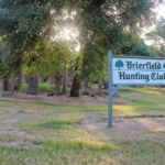 The Brierfield Hunting Club’s sign stands in front of all that remains of Jefferson Davis’s Brierfield mansion. The sign once featured the Confederate Battle Flag, which has been replaced with the live oak. (Hamilton, 2014) The Brierfield Hunting Club’s sign stands in front of all that remains of Jefferson Davis’s Brierfield mansion. The sign once featured the Confederate Battle Flag, which has been replaced with the live oak. (Hamilton, 2014)