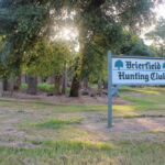 The Brierfield Hunting Club’s sign stands in front of all that remains of Jefferson Davis’s Brierfield mansion. The sign once featured the Confederate Battle Flag, which has been replaced with the live oak. (Hamilton, 2014) The Brierfield Hunting Club’s sign stands in front of all that remains of Jefferson Davis’s Brierfield mansion. The sign once featured the Confederate Battle Flag, which has been replaced with the live oak. (Hamilton, 2014)