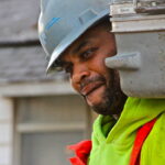 A worker removes toxic debris from the wreckage of Breezy Point. (December 2012) A worker removes toxic debris from the wreckage of Breezy Point. (December 2012)
