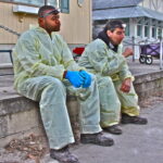 Exhausted workers rest after a day demolishing basements now toxic with mold. (December 2012) Exhausted workers rest after a day demolishing basements now toxic with mold. (December 2012)