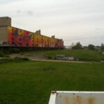 The Cotton Belt Freight Depot in St. Louis, formerly used used to unload cotton arriving from the South. It now features a mural called "Migrate." Photo by Eric Nost. depot