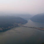 James Lindberg, Switzerland, 2015. A view of Lake Lugano, taken from atop Mt. San Salvatore. Fog hovers over the mountains in the background and the lake in the foreground is very calm.