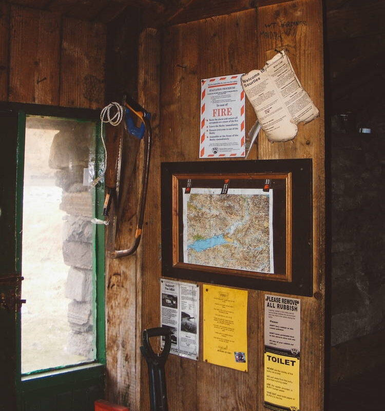 Sourlies, 2013. A map and some information signs hang on the wall.